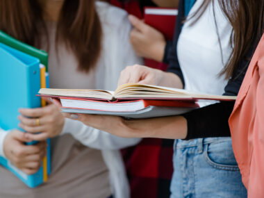 students reading textbooks