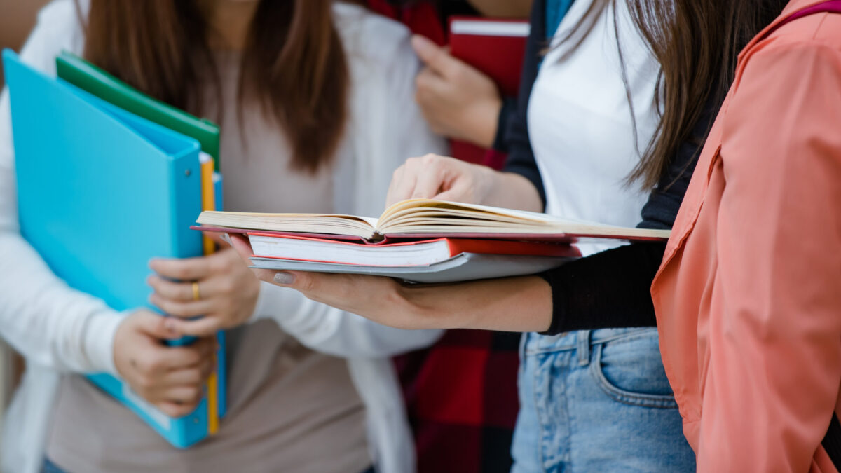 students reading textbooks